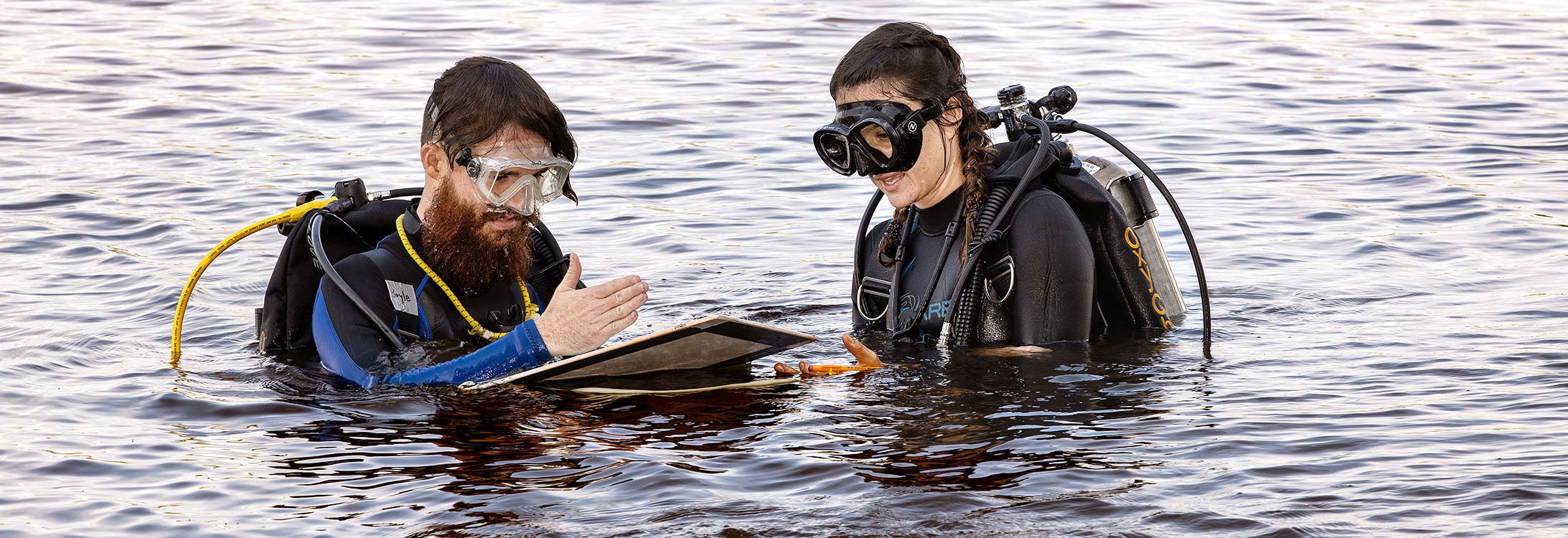 Graduate students Patrick Boyle, left, and Andi Yoxsimer document their research during investigation of the shipwreck in Washington, N.C. (Photo by Rhett Butler)
