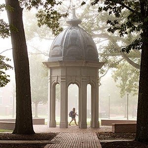 A student walks by the Cupola.