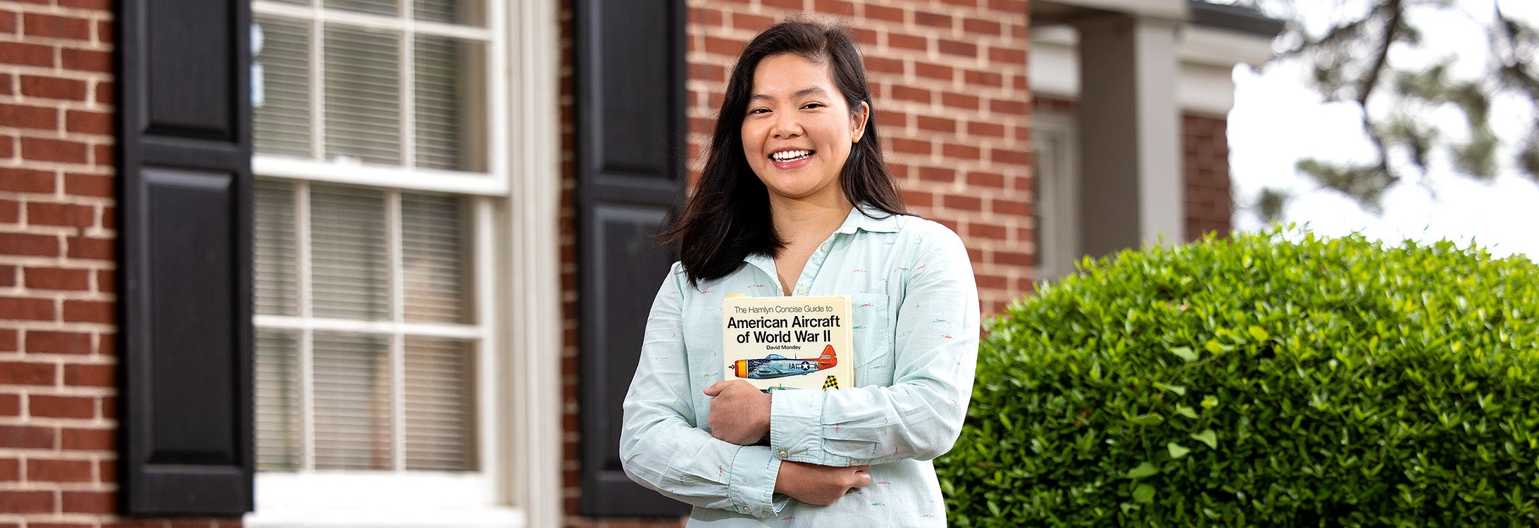 Aleck Tan, who received her master’s degree in maritime studies from ECU in 2020, has spent the past year as ECU’s Defense POW/MIA Accounting Agency (DPAA) Research Partner Fellow. (Photo by Rhett Butler)