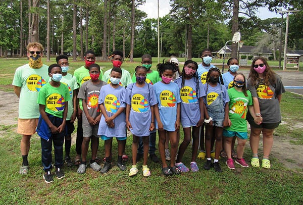 A group of campers pauses before heading to their next activity.