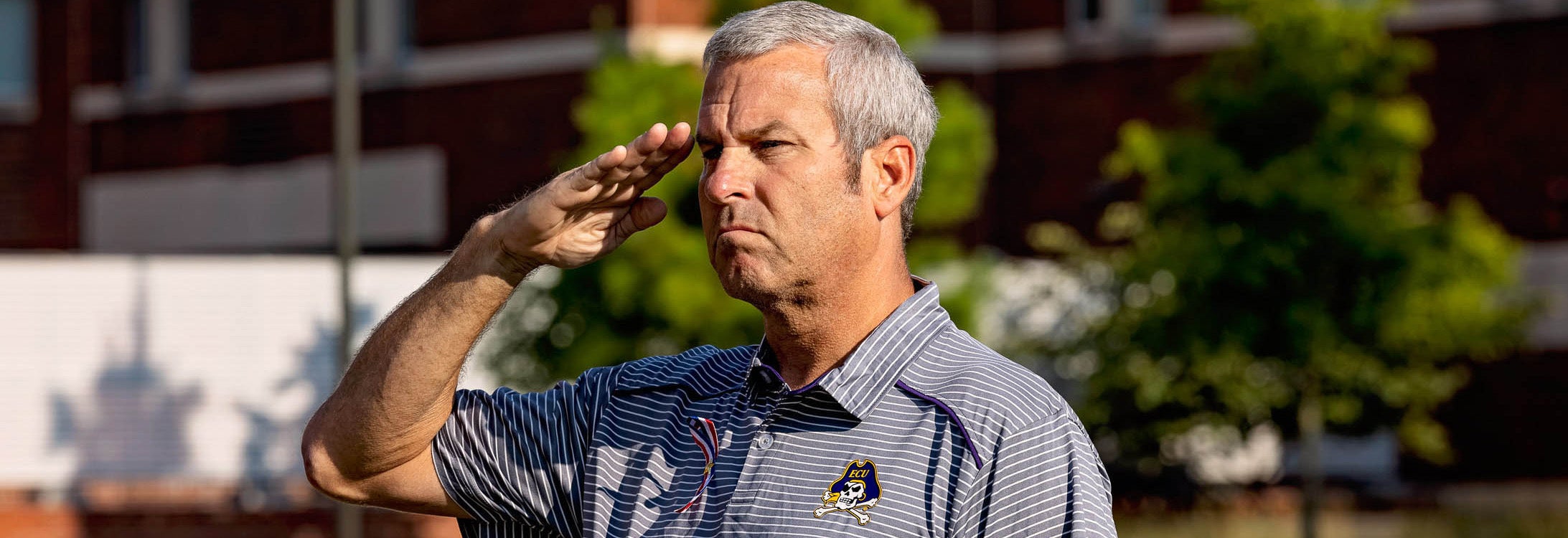 A salute is given during a 9/11 memorial dedication outside the Main Campus Student Center. ECU hosted a series of events during a weeklong commemoration of the 20th anniversary of the terrorist attacks. (Photos by Cliff Hollis)