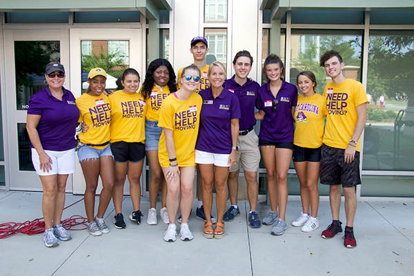 Margaret Turner is surrounded by student volunteers