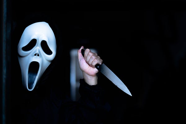 A masked killer named Ghostface is the villain in “Scream.” The film was written by ECU alumnus Kevin Williamson. (Shutterstock)