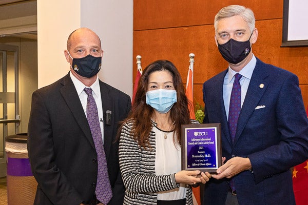 Department of Kinesiology Associate Professor Dr. Bomna Ko was presented the Award for Achievement in International Research and Creative Activity by Dr. Jon Rezek and Chancellor Philip Rogers.