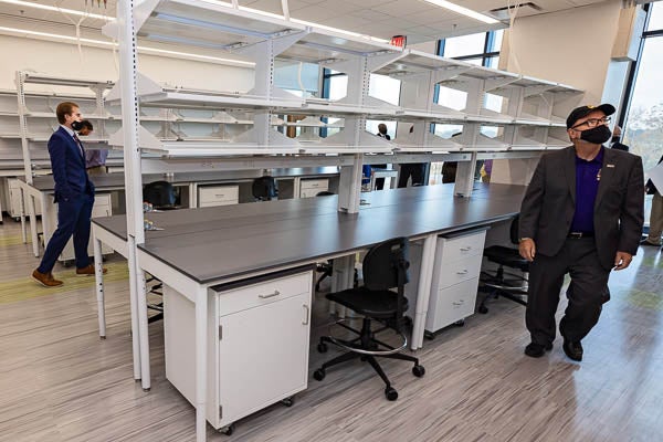 Lab space in the new building is explored during a tour.