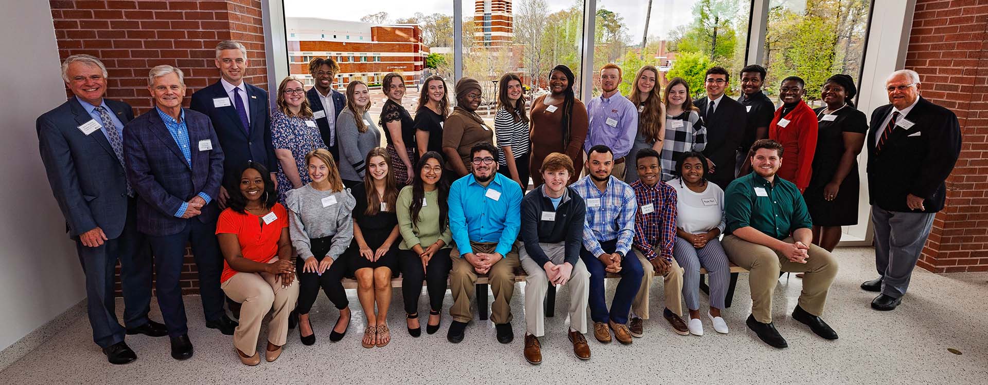 ECU’s Golden LEAF scholars pose for a picture with members of the Golden LEAF Foundation and Chancellor Philip Rogers.