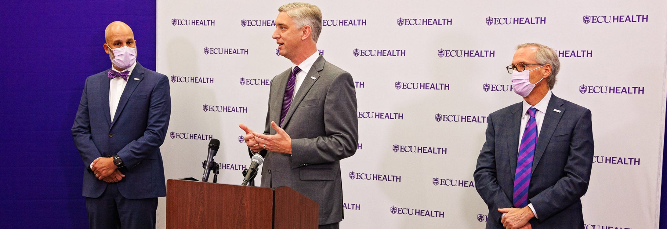 ECU Chancellor Philip Rogers and Dr. Michael Waldrum, CEO of Vidant Health, announce the new logo on April 14 for the ECU Health system.