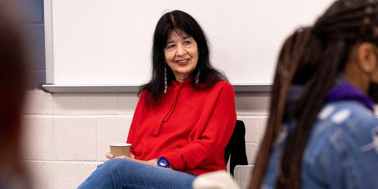 U.S. Poet Laureate Joy Harjo visits with students during a class prior to her public event at East Carolina University.