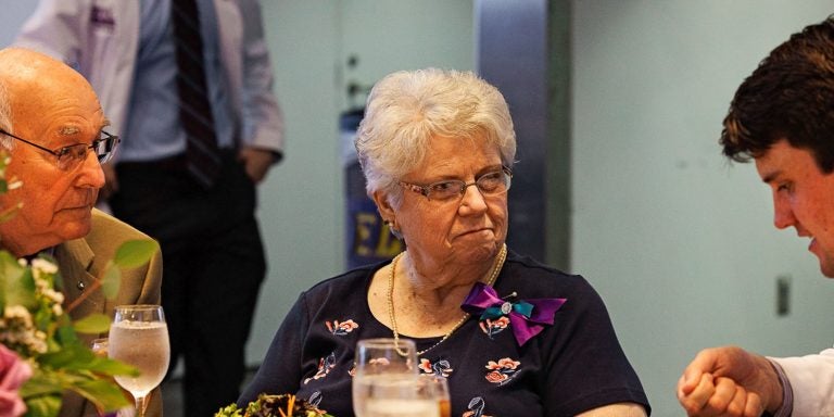 Brady Buchanan, a student in the Brody School of Medicine, talks with his Legacy Teacher, Carolyn Sutton Moore, during the Legacy Teachers celebration at the Murphy Center.