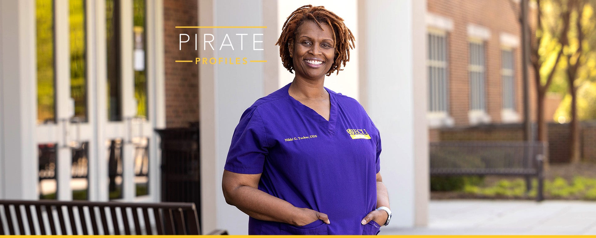 ECU School of Dental Medicine clinical assistant professor and division director Nikki Tucker poses outside.