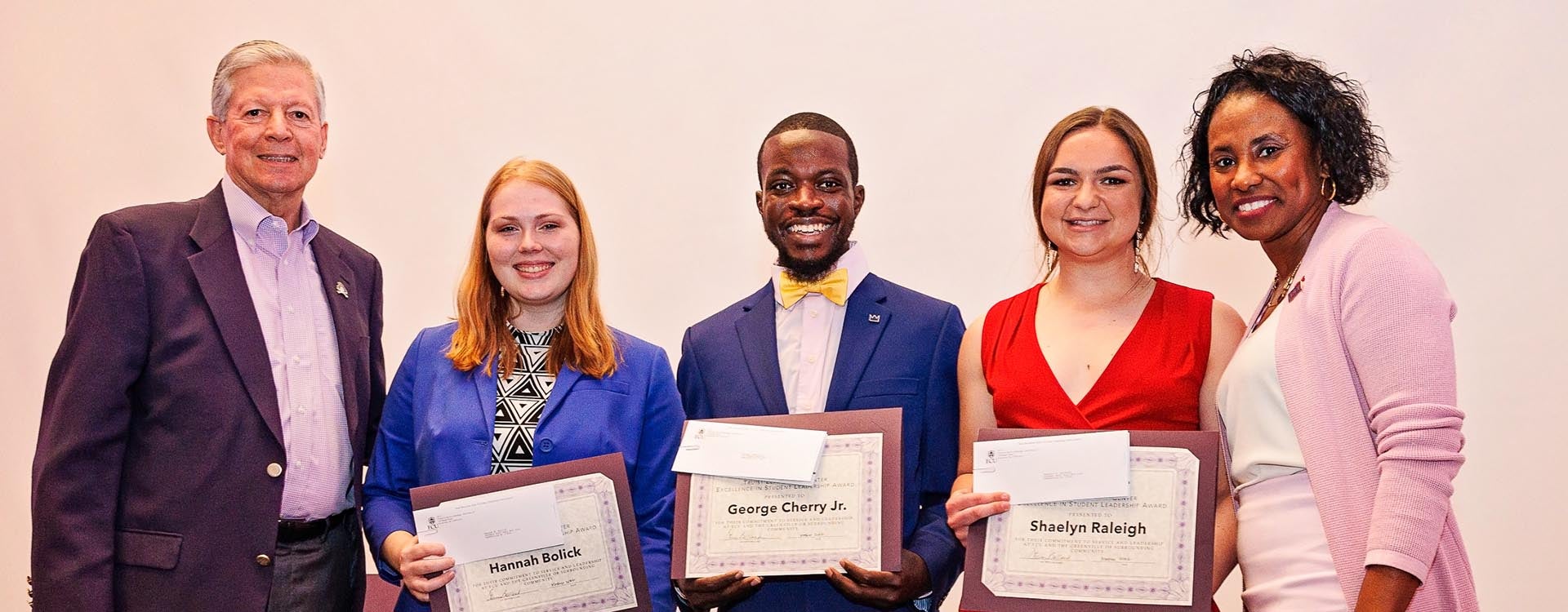 Former Chancellor Steve Ballard, left, and Dr. Virginia Hardy, vice chancellor for student affairs, far right, congratulate Hannah Bolick, George Cherry Jr. and Shaelyn Raleigh who received Truist Leadership Center Excellence in Student Leadership Awards. 