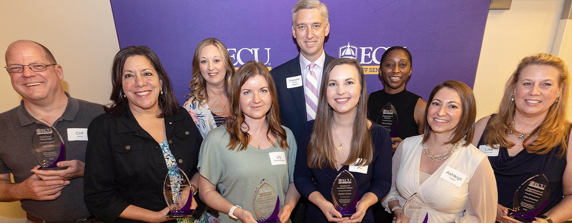 The 2022 Outstanding Staff Award winners receive congratulations from Chancellor Philip Rogers. 