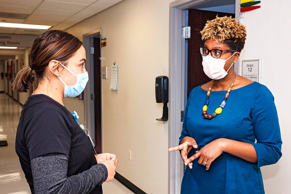 Dr. Rasheeda Monroe talks with a colleague at WakeMed in Raleigh.