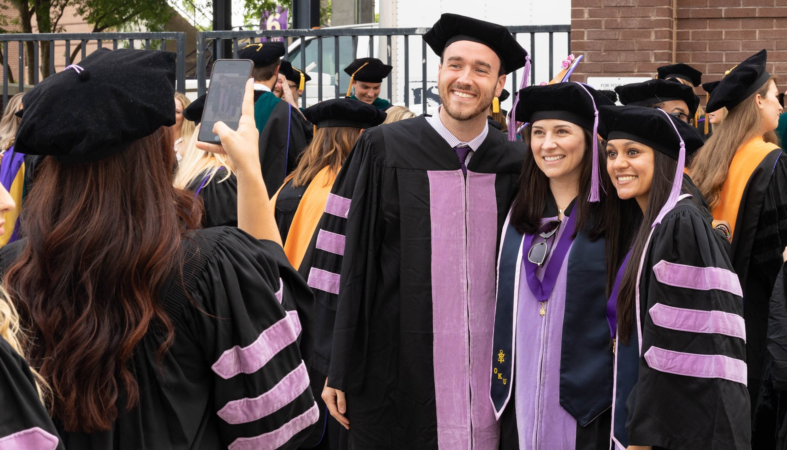 Graduates from the School of Dental Medicine pose for a photo before the commencement ceremony. 