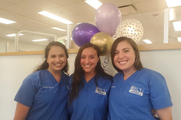 Fourth-year ECU School of Dental Medicine students Rachel Downs, Rebecca Agner and Kari Wordsworth celebrated the 10th anniversary of CSLC–Ahoskie on June 3.