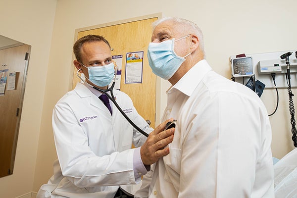 Dr. Jason Foltz works with a patient at the Family Medicne Center. 