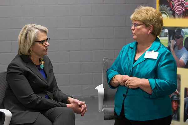 Robin Tutor Marcom, director of the NC Agromedicine Institute, speaks to Margaret Spellings, then president of the University of North Carolina system, in 2016.