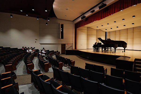 Peers listen as Yao performs in Fletcher Recital Hall during an East Carolina Piano Festival master class.