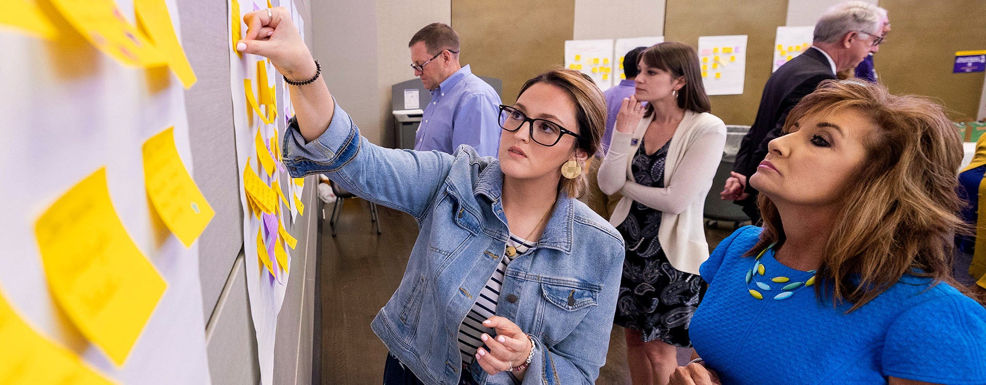 Melissa Watterson and Lynn Roeder participate in a brainstorming activity during the resilient campus summit at the Main Campus Student Center. 