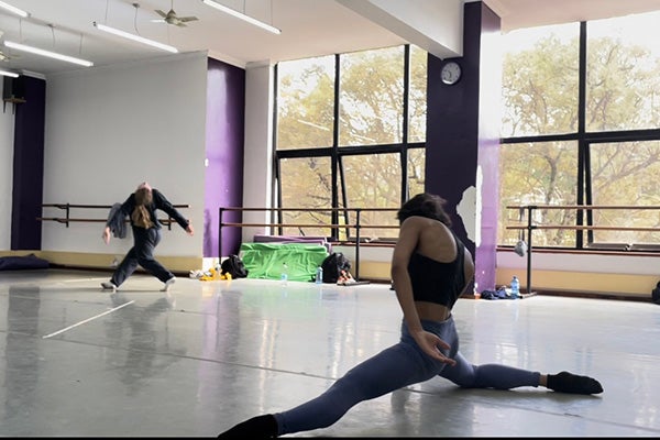 ECU students Elizabeth Bailey and Melody Martinez dance in a master class in Kenya.