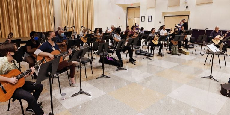 Guest instructor John Porter conducts the ensemble at ECU’s Summer Guitar Festival.