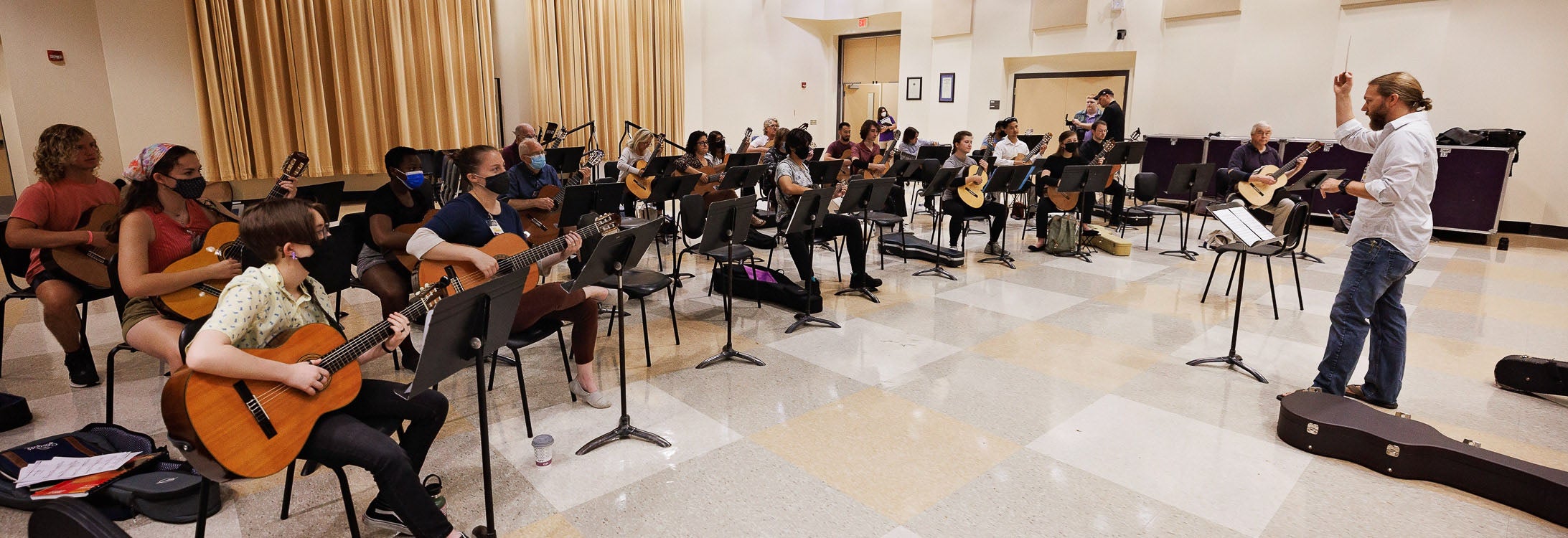 Guest instructor John Porter conducts the ensemble at ECU’s Summer Guitar Festival.