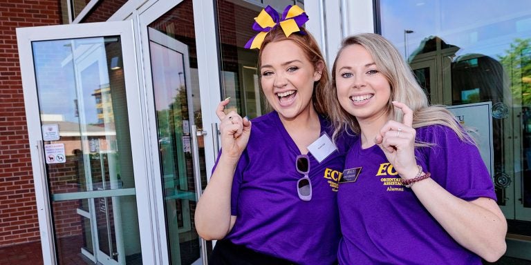 Austin Vick, left, and Emily Wiggins were two of 17 ECU alumni who returned to campus on June 13 to help lead new student orientation sessions.