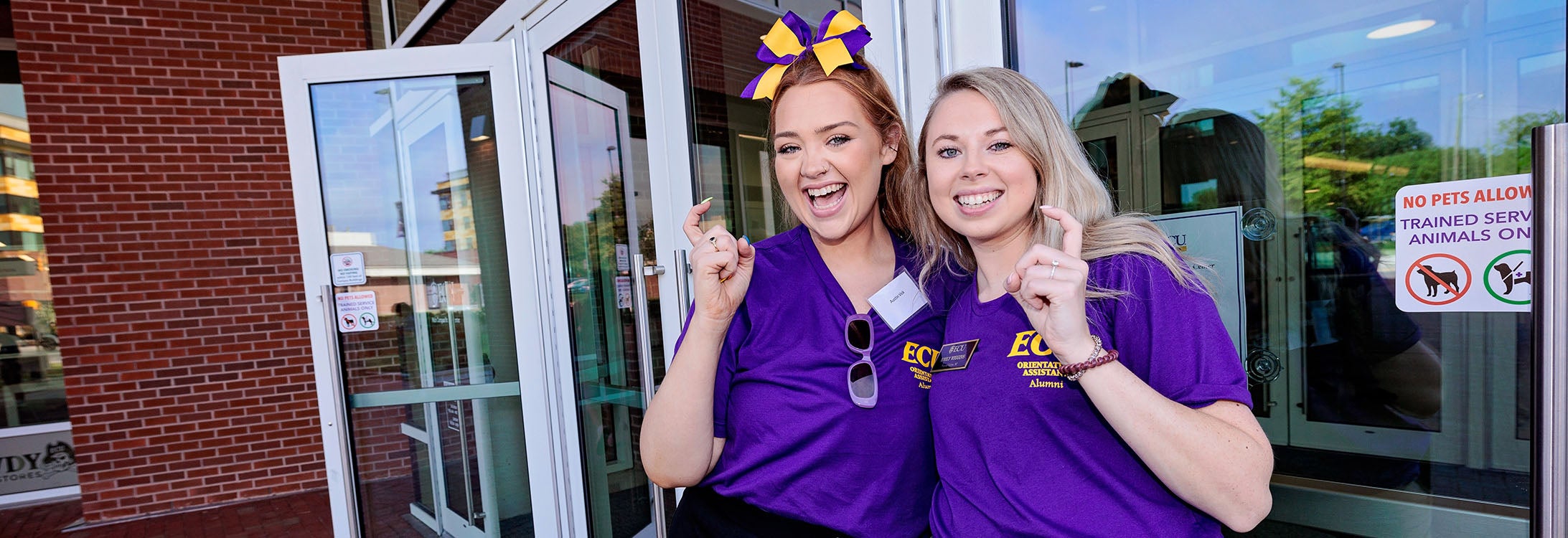 Austin Vick, left, and Emily Wiggins were two of 17 ECU alumni who returned to campus on June 13 to help lead new student orientation sessions.