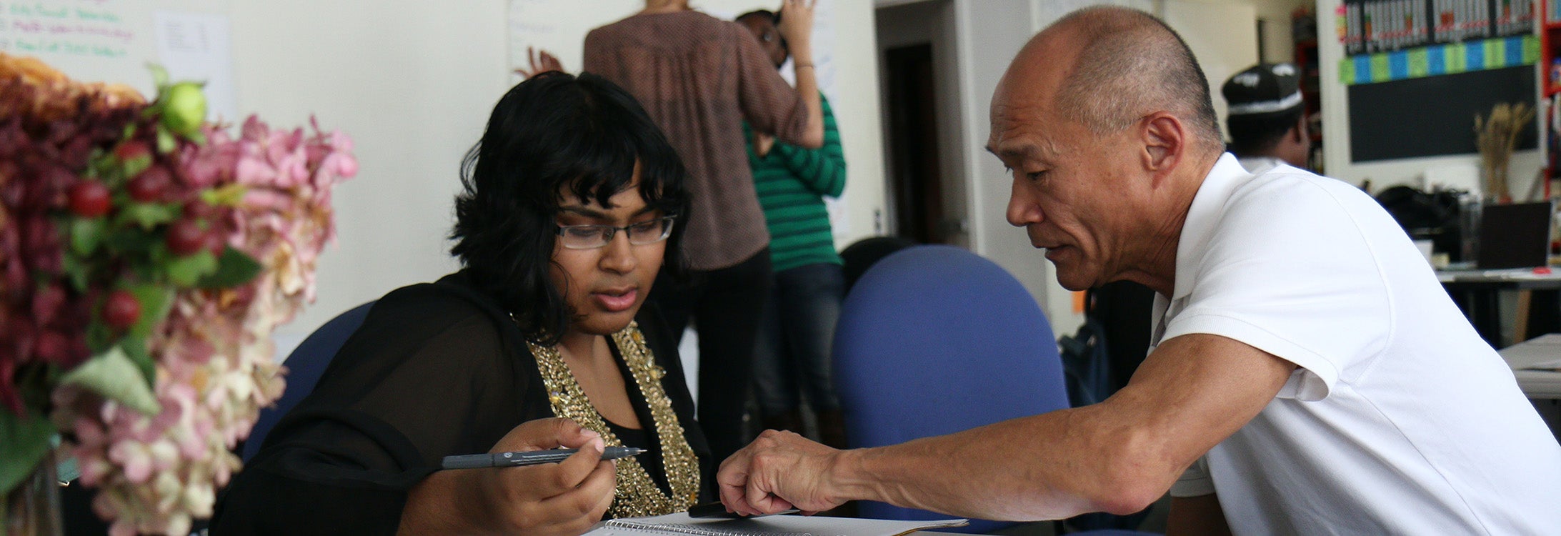 Adult learners in a classroom.