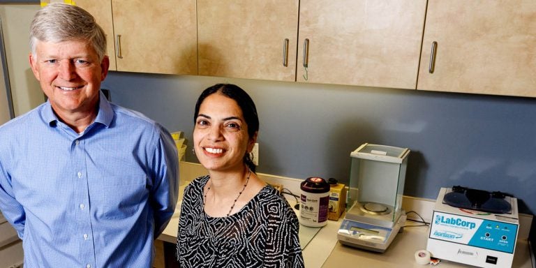 Dr. Darrell Neufer, and Dr. Shahaz Aziz pose in the ECHI. They are studying workaholism and insulin levels.