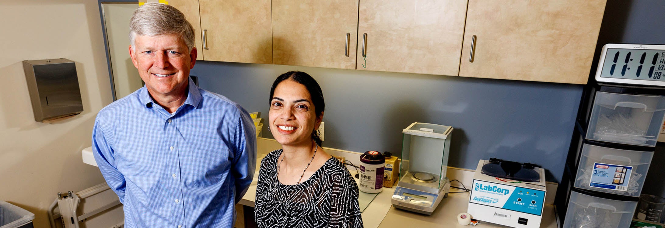 Dr. Darrell Neufer, and Dr. Shahaz Aziz pose in the ECHI. They are studying workaholism and insulin levels.