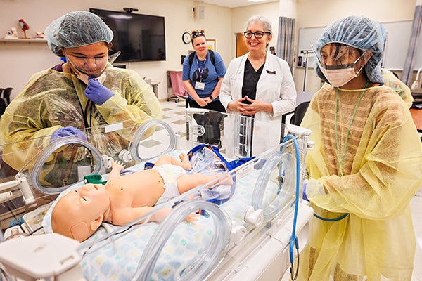 Campers learn how ECU’s College of Nursing is using manikins and technology to help train nursing students as part of the the university's 2022 MIS STeM camp.