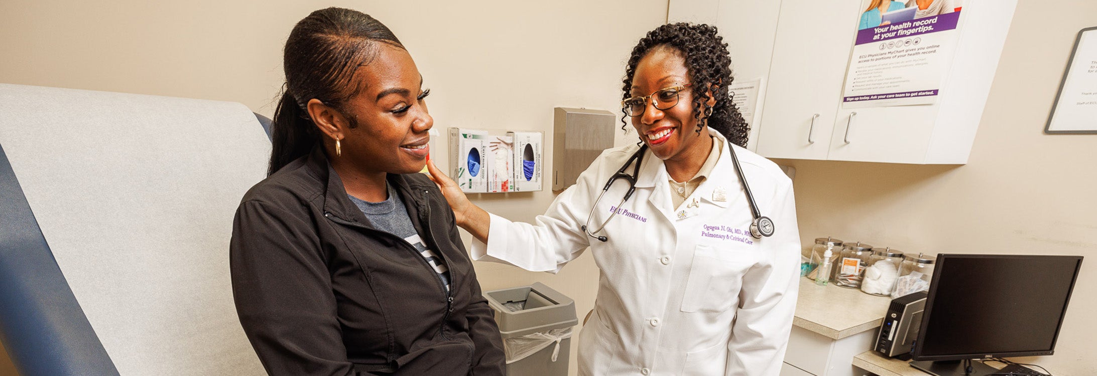 Dr. Ogugua Ndili Obi, assistant professor of pulmonary and critical care, listens to a patient’s lung sounds at Brody School of Medicine’s sarcoidosis clinic.