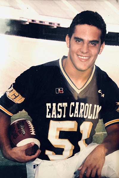 Former East Carolina University football walk-on Carlos Ochoa faced challenges as incoming international student, but learned lessons in Greenville that anchored him for the rest his life.