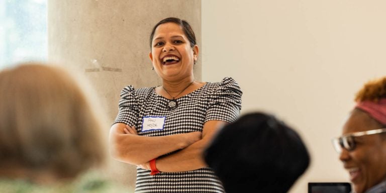 Dr. Archana Hegde talks to statewide evaluators and mentors during a 15-year celebration of Early Educators Support at the ECU Main Campus Student Center.