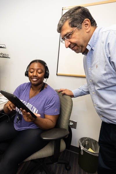 Dr. Tarek Abdel-Salam, director of the Center for Sustainable Energy and Environmental Engineering, works with student Ariel Lineberger in the center’s student office in the Rivers Building.