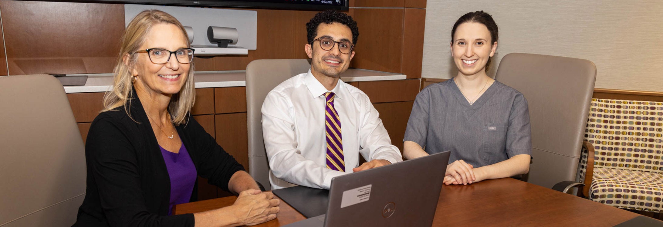 Dr. Suzanne Lazorick, left, professor of pediatrics and chair of the Department of Public Health at the Brody School of Medicine, discusses rural adolescent activity research with Brody student Sina Kazemzadeh, center, and Brody alumna and ECU Health resident Dr. Chloe Opper.