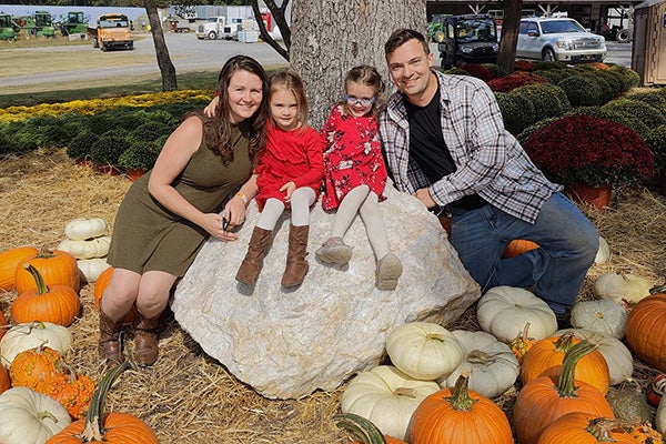 Rebecca Cole, a speech language pathology student, poses with her family. Cole received one of 12 national Association of Schools Advancing Health Professions Scholarship of Excellence scholarships. 