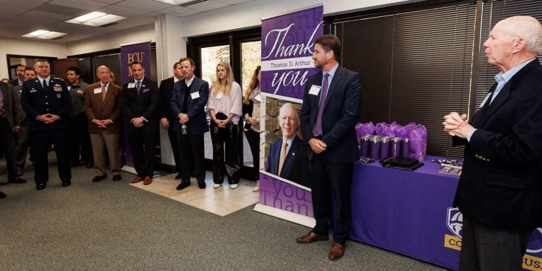 Tom Arthur, far right, speaks to the crowd at the Thomas D. Arthur Graduate School of Business event. Arthur's $5 million gift to the East Carolina University College of Business will lead to transformational work for the graduate school.