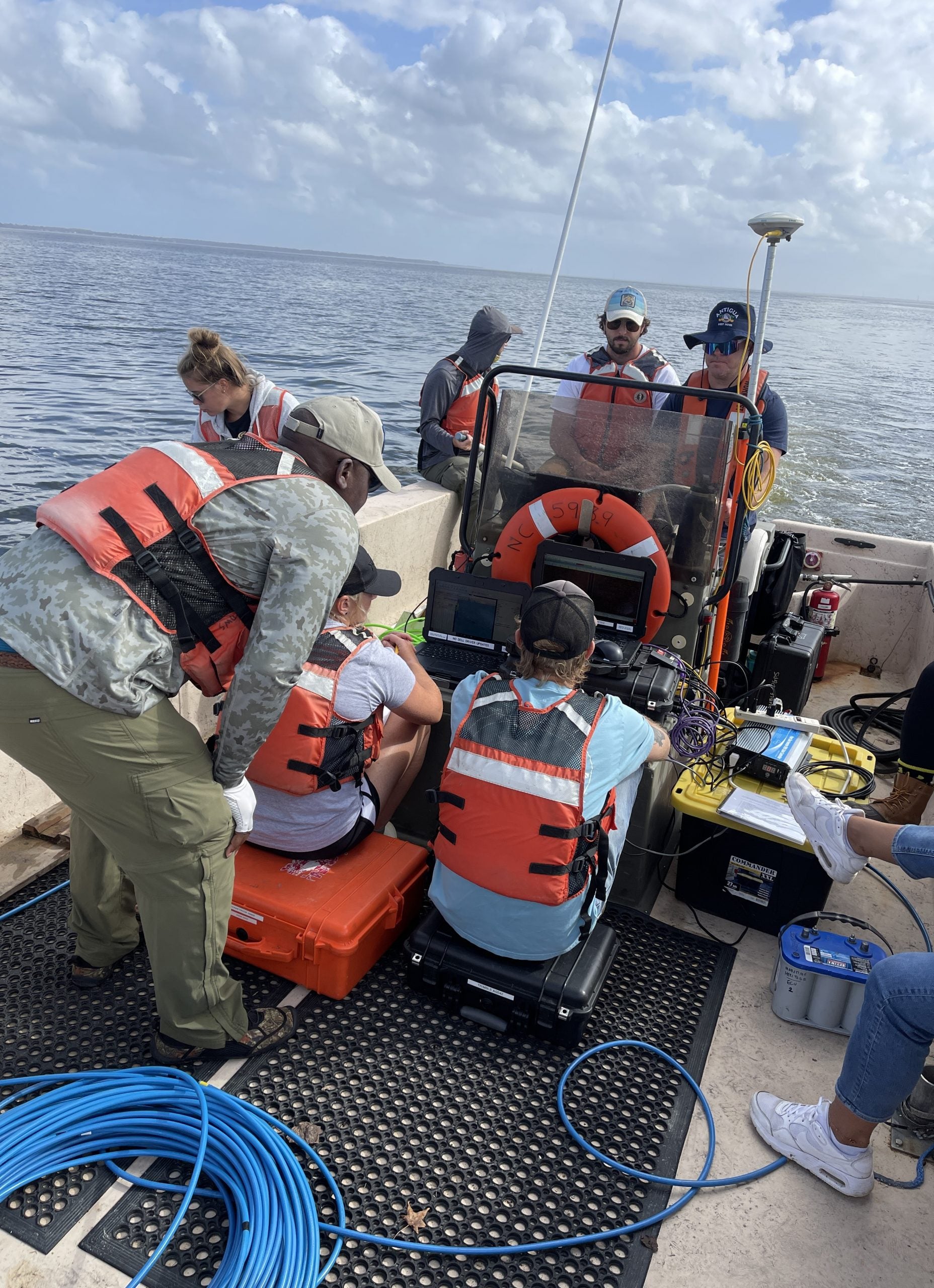 ECU students and staff use a side scan sonar and magnetometer to search the waters of Albemarle Sound. 