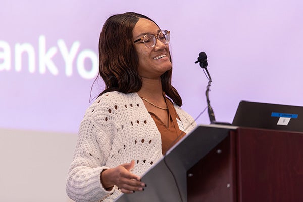Cheyanne Ware, a non-traditional undergraduate student majoring in university studies with minors in Russian studies and public health, shares the value of her scholarship at the 2022 Thomas Harriot College of Arts and Sciences annual scholarship luncheon.
