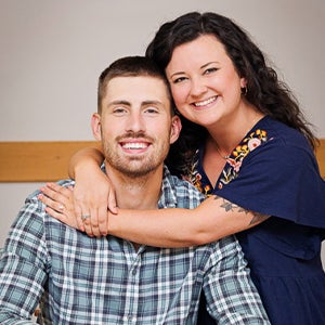 Engaged couple Chloe Ament, left, and Nick McNeill pose together. The couple went on its first date thanks to one of Rappleyea's classroom assignments.