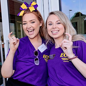 Austin Vick, left, and Emily Wiggins were two of 17 ECU alumni who returned to campus on June 13 to help lead new student orientation sessions. 