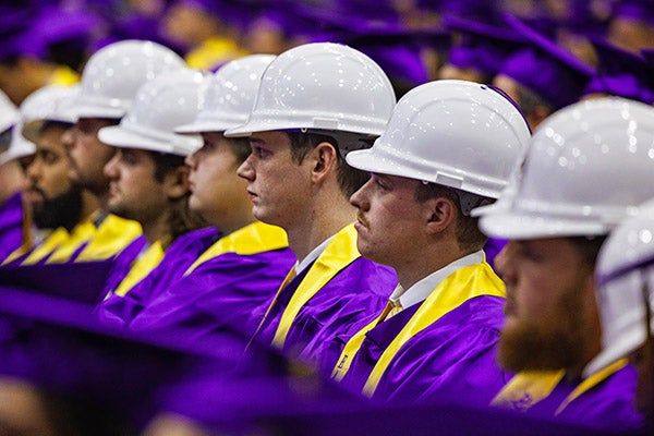 ECU College of Engineering and Technology graduates wear their hard hats during the commencement ceremony.