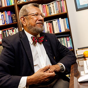 Dr. Sy Saeed talks to a student from Elizabeth City from his office in Brody. 