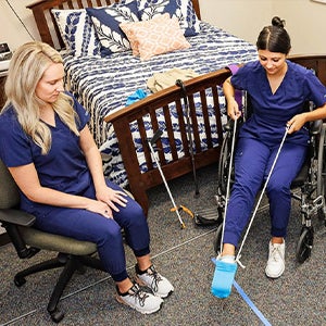 ECU occupational therapy students practice guiding patients through life tasks in the College of Allied Health’s simulated apartment, where students use hands-on approaches to learn occupational therapy skills.