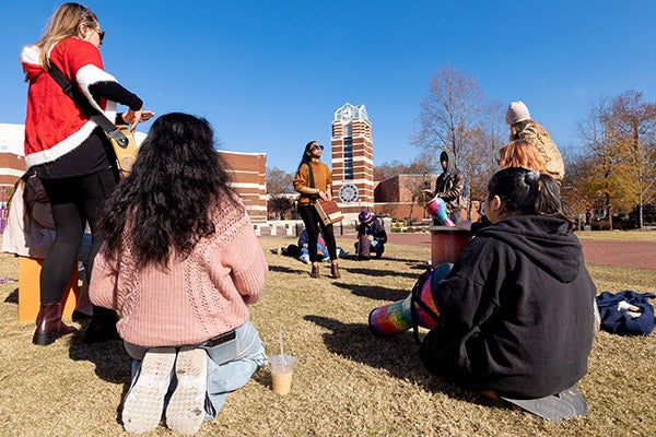 East Carolina University music major Sheleise Melendez leads group drumming on the Main Campus Student Center lawn. 