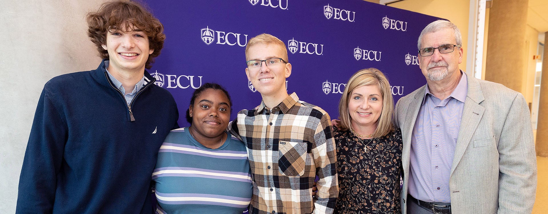 Bradly Boaz, from left, and Krysta Byrd were recognized for their efforts to help Blake Solomonson during a medical emergency. Solomonson and his parents, Becky and Rich Belthoff, attended a recognition ceremony for Boaz and Byrd at ECU’s Main Campus Student Center.