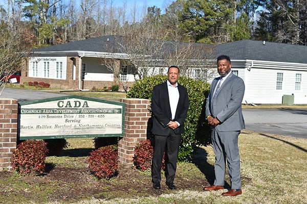 Merrill Flood, director of the East Carolina Research and Innovation Campus development, and Chris Moody, executive director of the Choanoke Area Development Association, celebrate the announcement of the Choanoke Area HOME Consortium that will help address housing needs for low-and moderate-income families in northeast North Carolina.