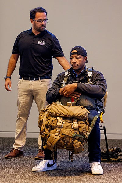 Kinesiology instructor Patrick Rider, left, guides a body movement demonstration involving the 112th Special Operations Signal Battalion (Airborne).